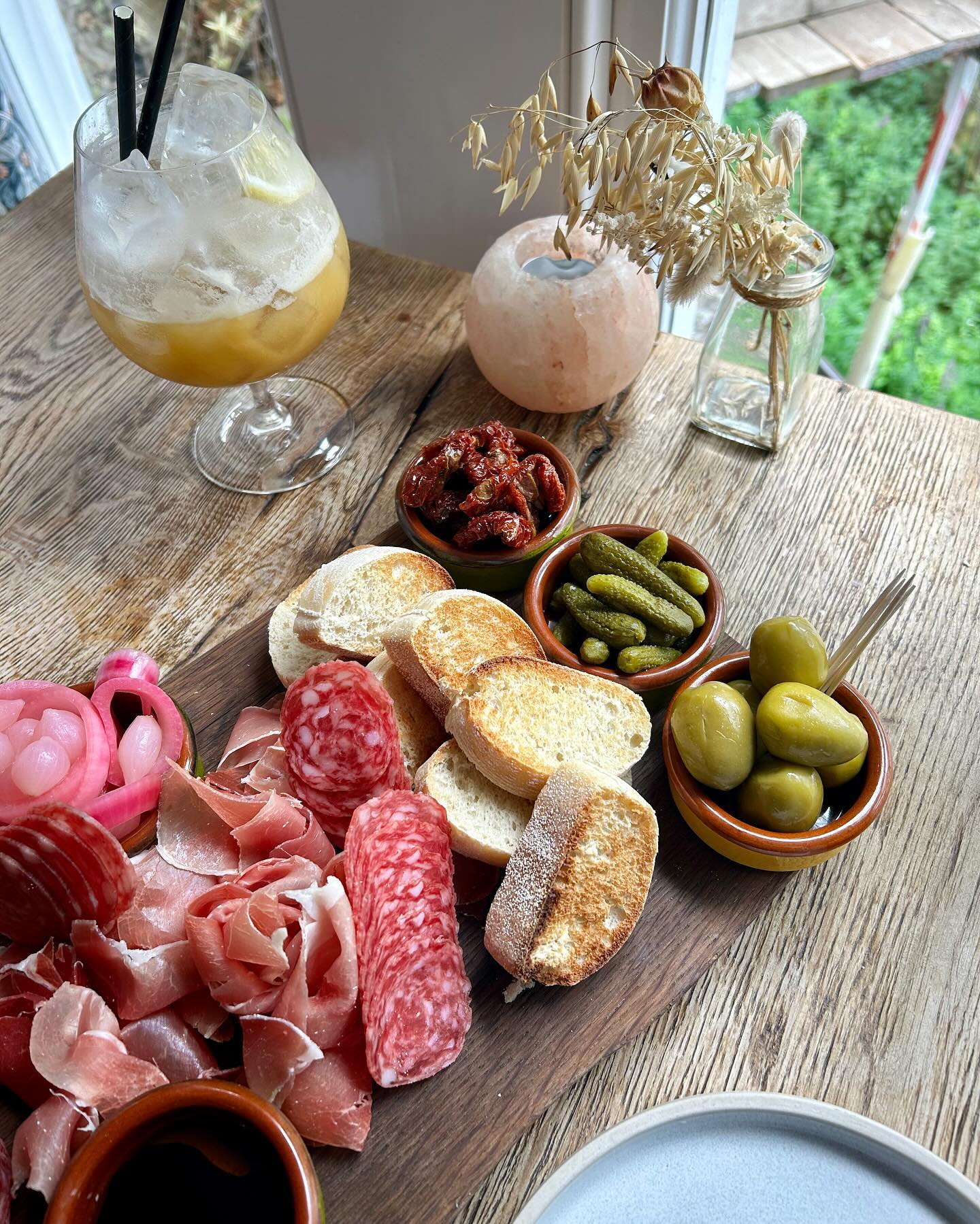 Food served on a wooden table at The Dashwood Lounge