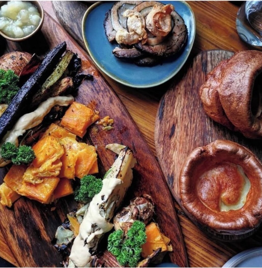 Plates and bread on a table at The Dashwood Lounge
